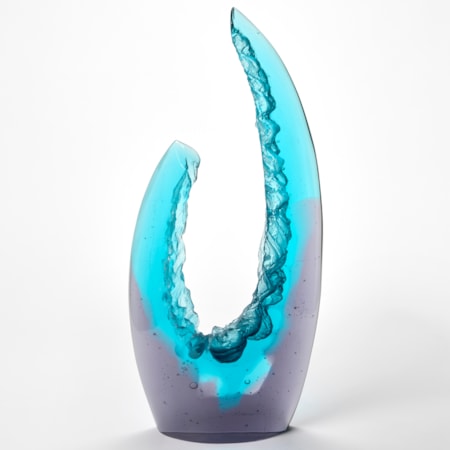 tall abstract glass sculpture with a gradient from deep purple at the base to bright turquoise at the top with the form reaching and curving upwards into two asymmetrical points  creating an open crescent like structure and the interior edges with rock like surface texture hand made from cast glass
