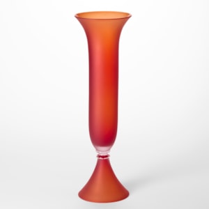 tall classical fluted vase with flared elegant conical foot and mirroring flared top edge in opaque matt orangey red hand blown from glass using venetian techniques