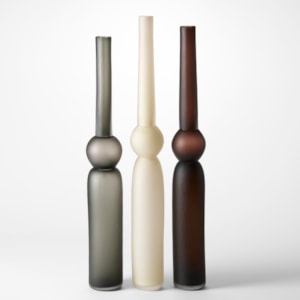 tall column vases created from three stacked forms with two long and tubular and the central one a sphere in grey alabaster and brown each with a matt brushed finish hand blown from glass
