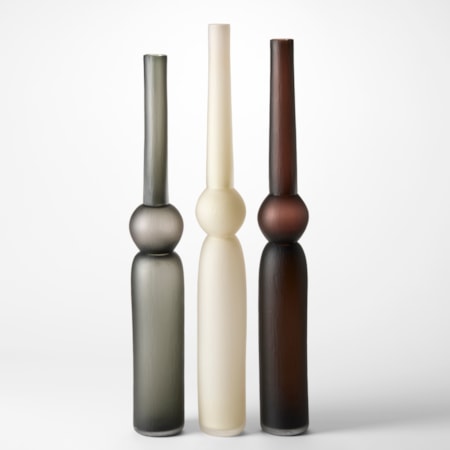 tall column vases created from three stacked forms with two long and tubular and the central one a sphere in grey alabaster and brown each with a matt brushed finish hand blown from glass