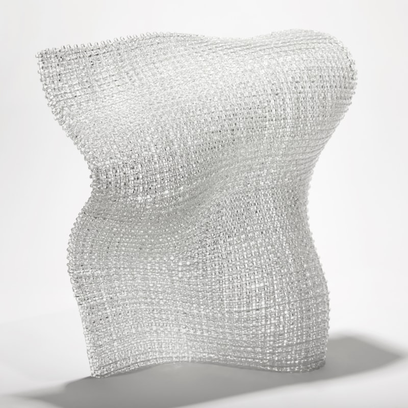clear standing undulating soft square glass form with the appearance of woven fabric created from layers of glass canes