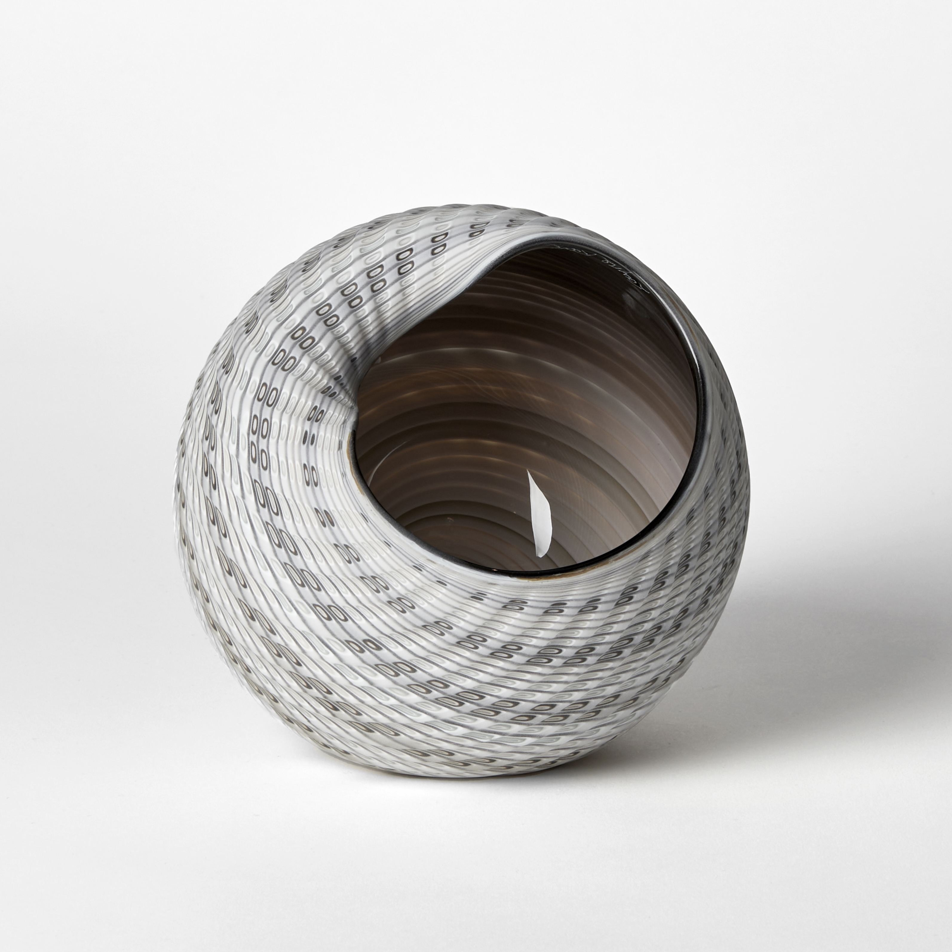 round shell like vessel with large opening glossy interior and matt exterior with incised patterned cut surface and bands of colour in bronze light grey alabaster and white 