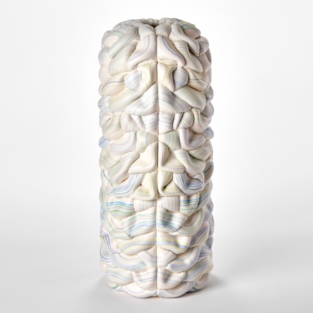sculptural column vessel made of stacked interwoven ridged white rings with bands of pastel colours with central front seam and both halves mirroring each other