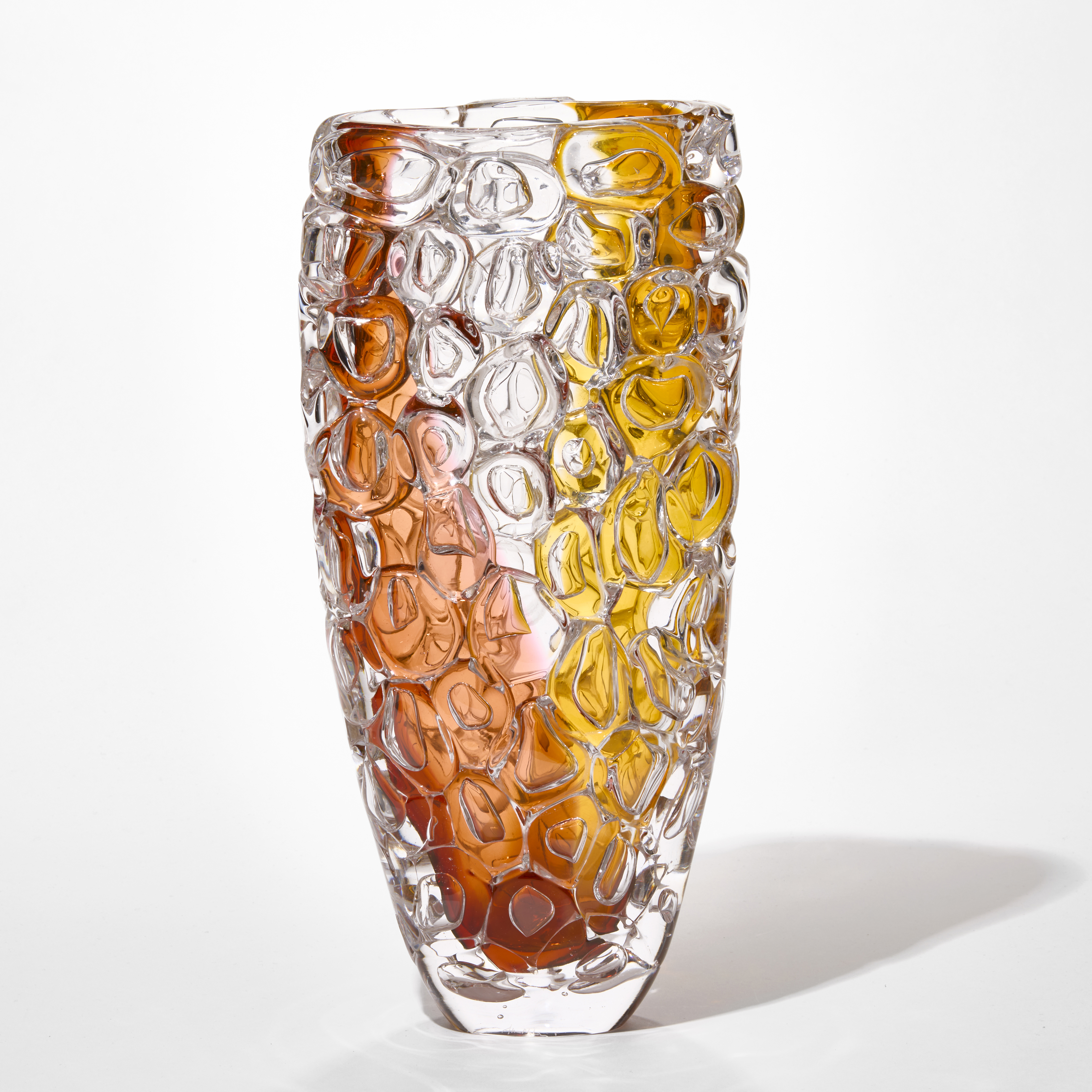 tall flaring transparent vase with the exterior covered in oversized bubbles with two swathes of banded colour from the top to bottom on each side one in sienna and one in amber hand blown from glass