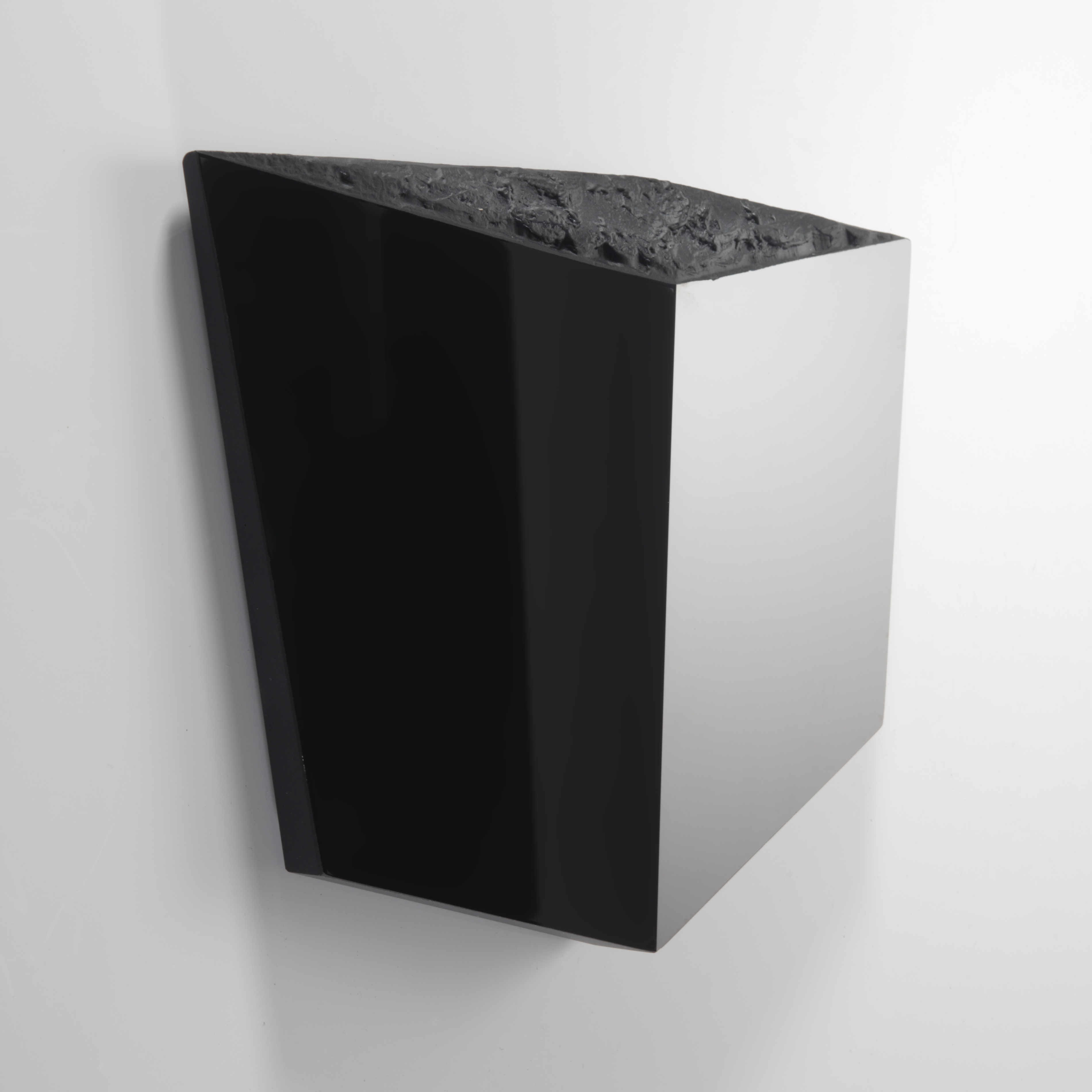abstract flat deep perspective black cube with polished mirror sides and the top with a highly organic texture like the surface of the moon