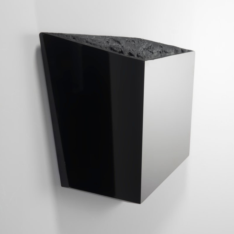 abstract flat deep perspective black cube with polished mirror sides and the top with a highly organic texture like the surface of the moon
