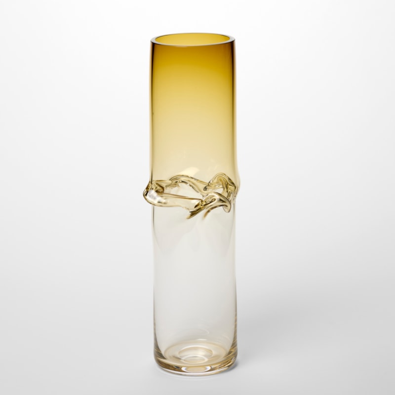 tall cylindrical vessel fading from rich amber at the top to clear at the base with a central creased waisted section hand blown from glass