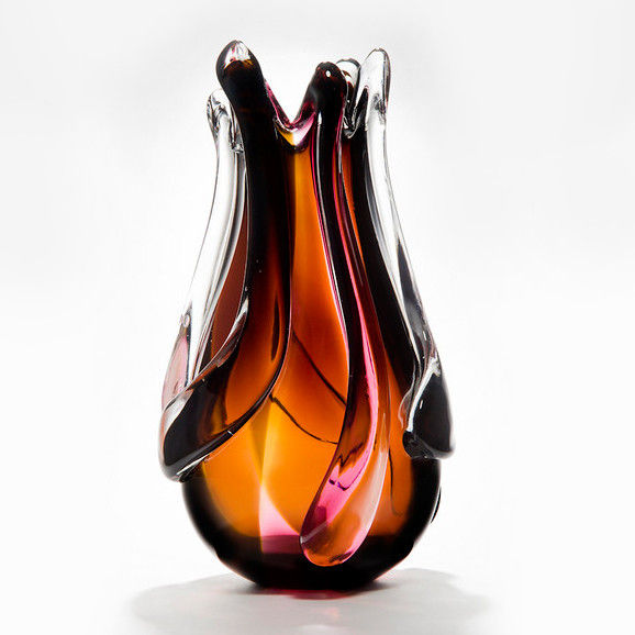 art glass vase in flame shape in dark orange red brown and purple
