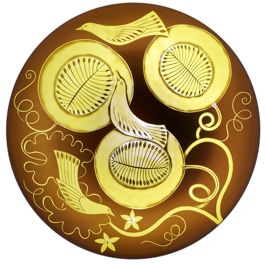 glass art plate in brown with yellow motifs of birds and flowers