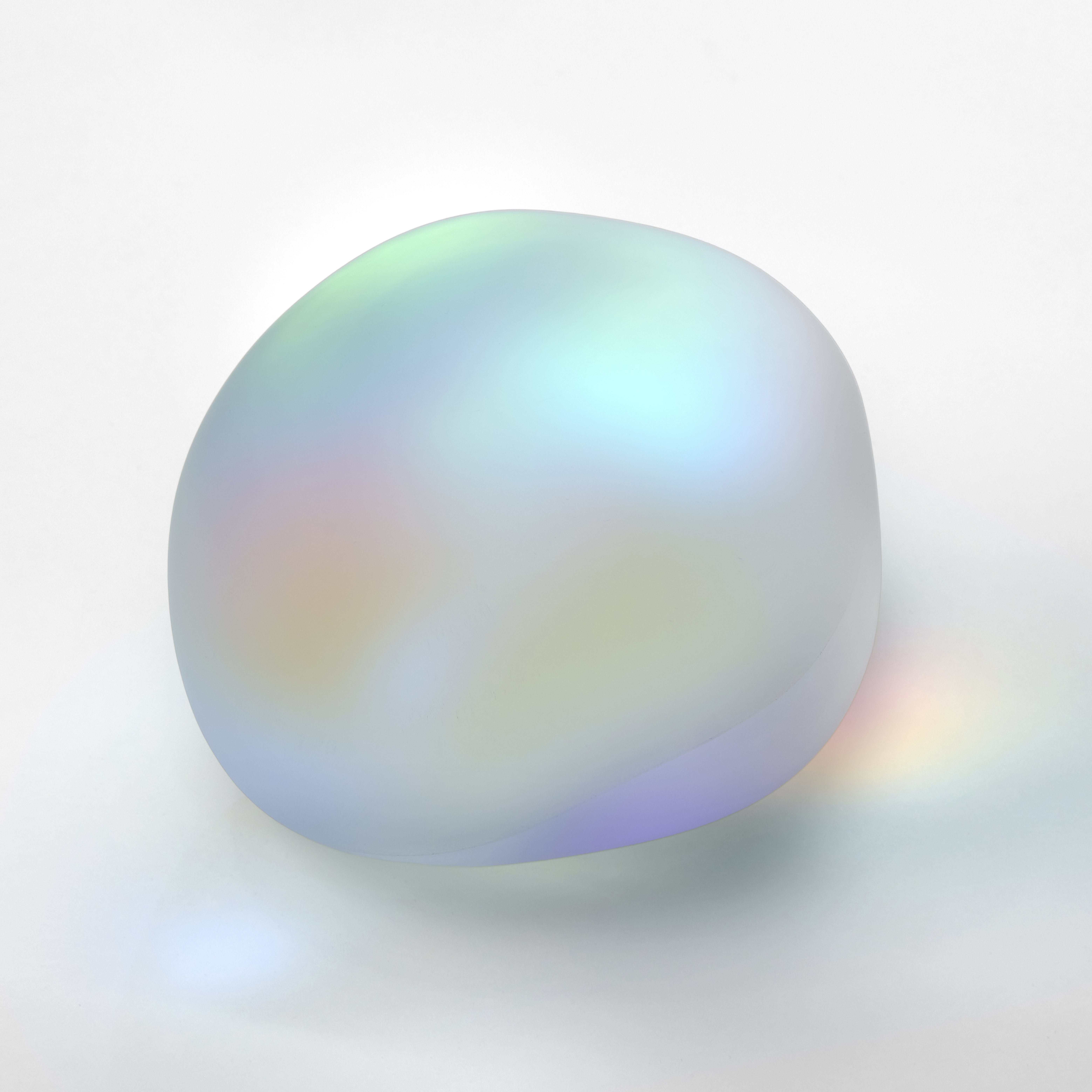 satin smooth round opaque pebble with soft iridescent colours emitting from within hand made from glass