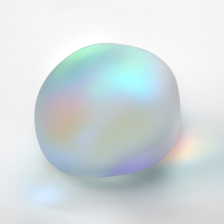 satin smooth round opaque pebble with soft iridescent colours emitting from within hand made from glass