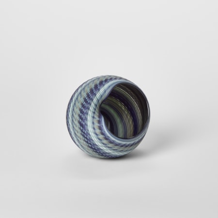 round vessel with matt exterior created from interwoven strands of indigo blue jade soft grey and celadon hand blown from glass with a glossy interior