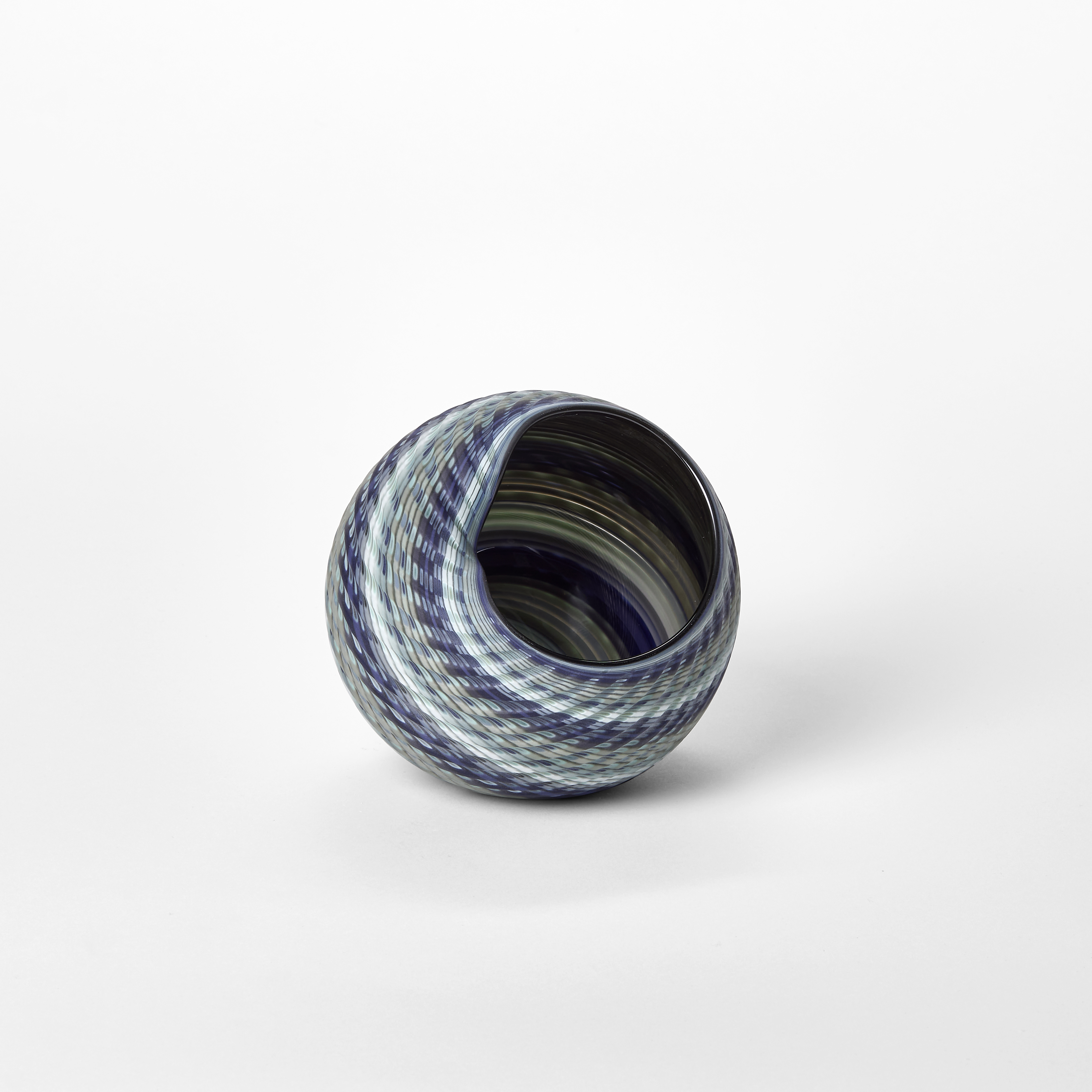round basket woven form with a matt surface and bands of colour in blue jade indigo and celadon hand blown from glass