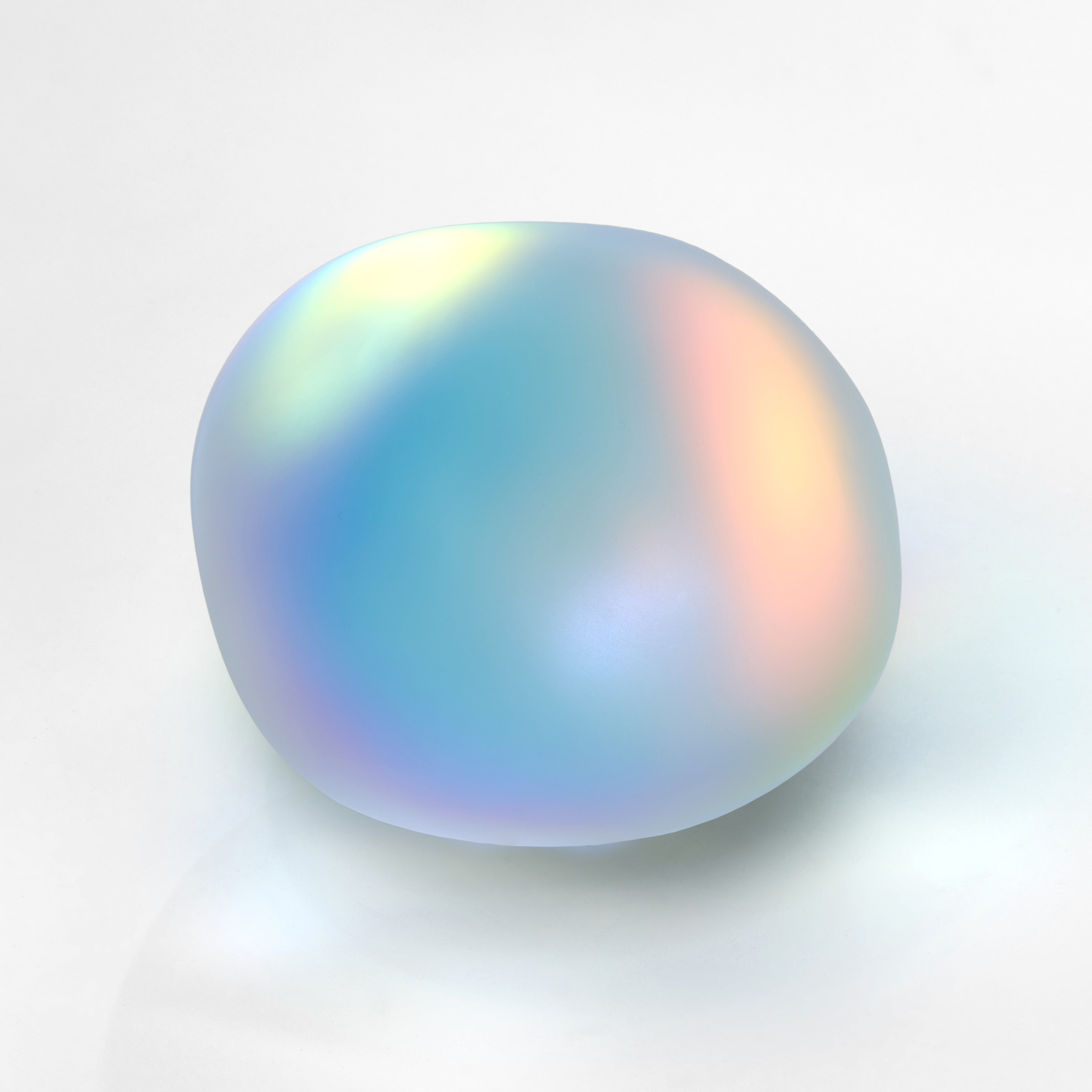 round smooth semi transparent clear pebble with iridescent colours emitting from within hand made from glass