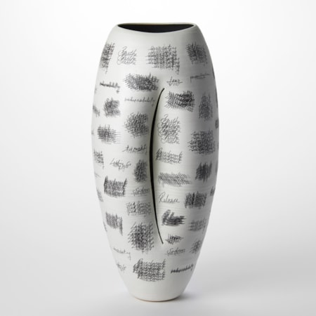 tall white oval vessel with curved slit on the front and a black interior with the surface covered in repeated lines of black hand writing hand made from clay