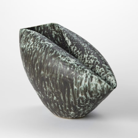 dark pewter and soft celadon speckled ceramic centrepiece origami inspired created from a round bowl with one side folder back in on itself creating two elongated rims joined via a rounded crease hand made from clay