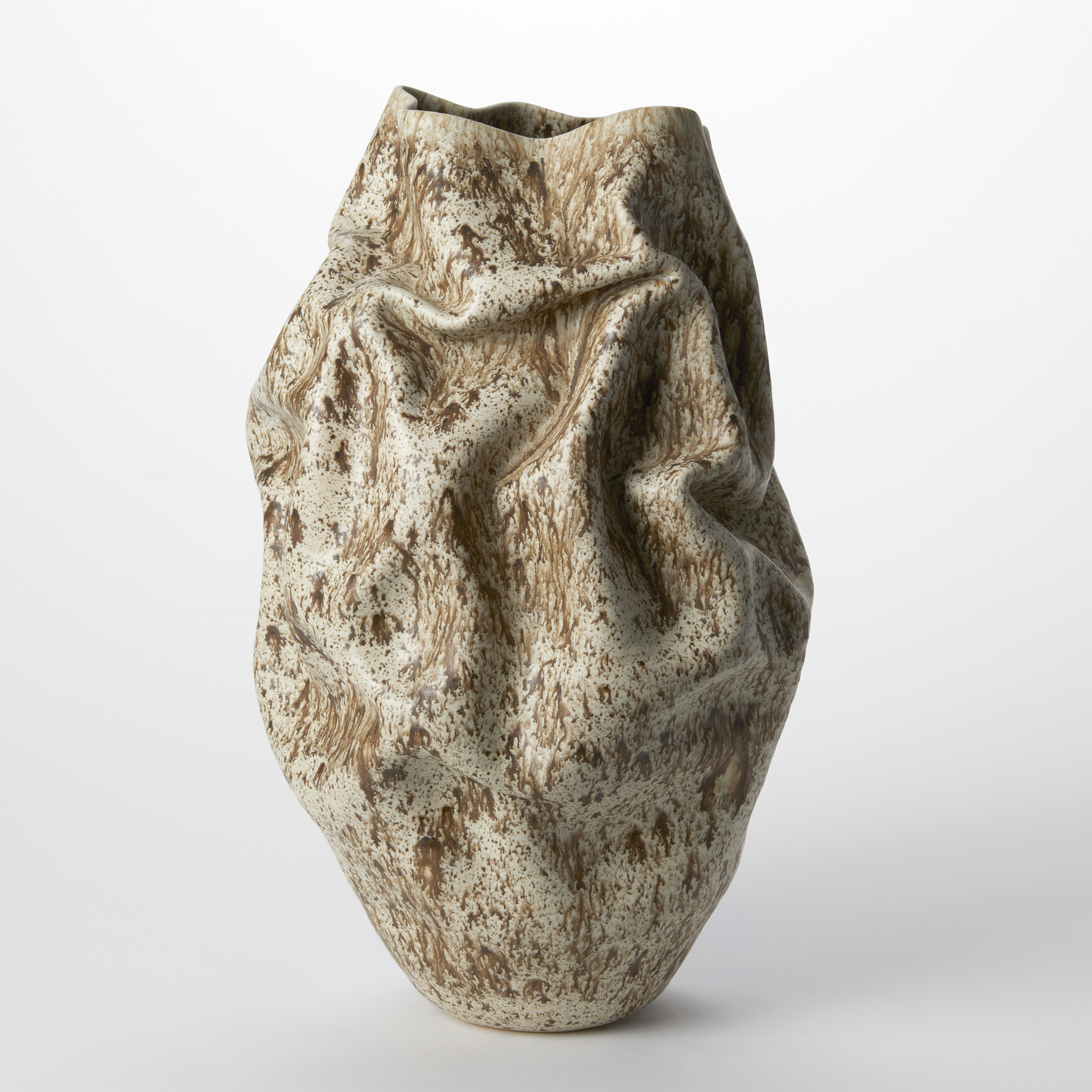 taupe ovoid softly creased vessel with a brown organic pattern all over the surface resembling lichen hand made from white saint thomas clay