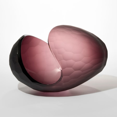 prone ovoid shape in soft matt aubergine colour with the outer surface with a large incised repeat cut scalloped pattern hand blown from glass