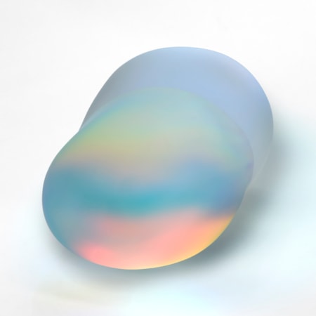 peanut shaped opaque semi transparent stone with a smooth surface and iridescent colours emitting from within hand made from glass