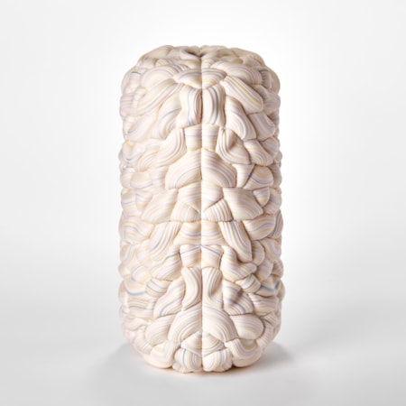stacked sculptural vessel made up of interwoven sugary ridged rings in white with bands of soft pastel colours with front seam and the two halves mirroring each other