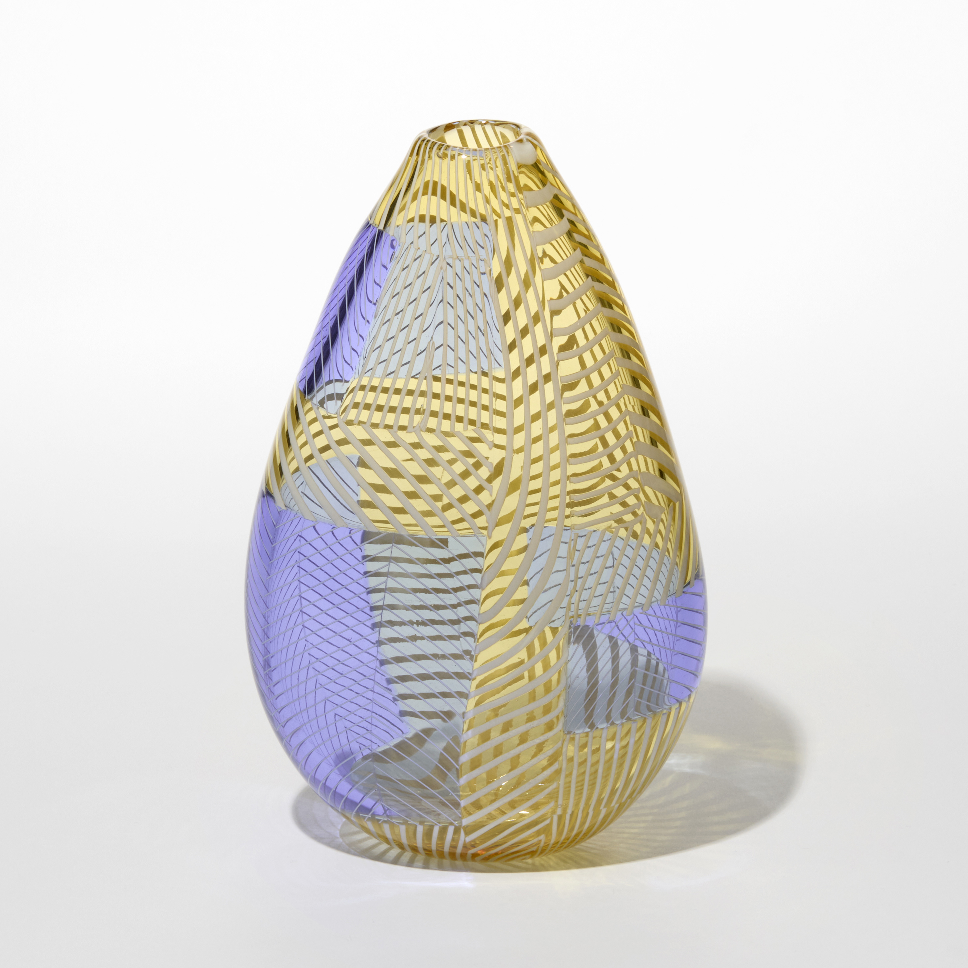 teardrop shaped transparent glass vase featuring a complex interplay of translucent lavender and golden yellow tones with the surface decorated with woven ribbon like patterns that crisscross in layered geometric sections creating an almost textile like effect hand made from blown glass