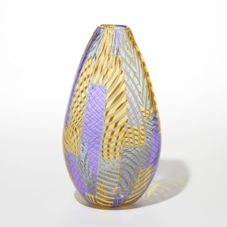 teardrop shaped glass vase with a narrow opening at the top and the surface decorated with interwoven diagonal and vertical patterns in golden yellow lavender purple and pale blue creating a textured optical effect with a mix of translucent and opaque areas giving woven appearance hand made from blown glass