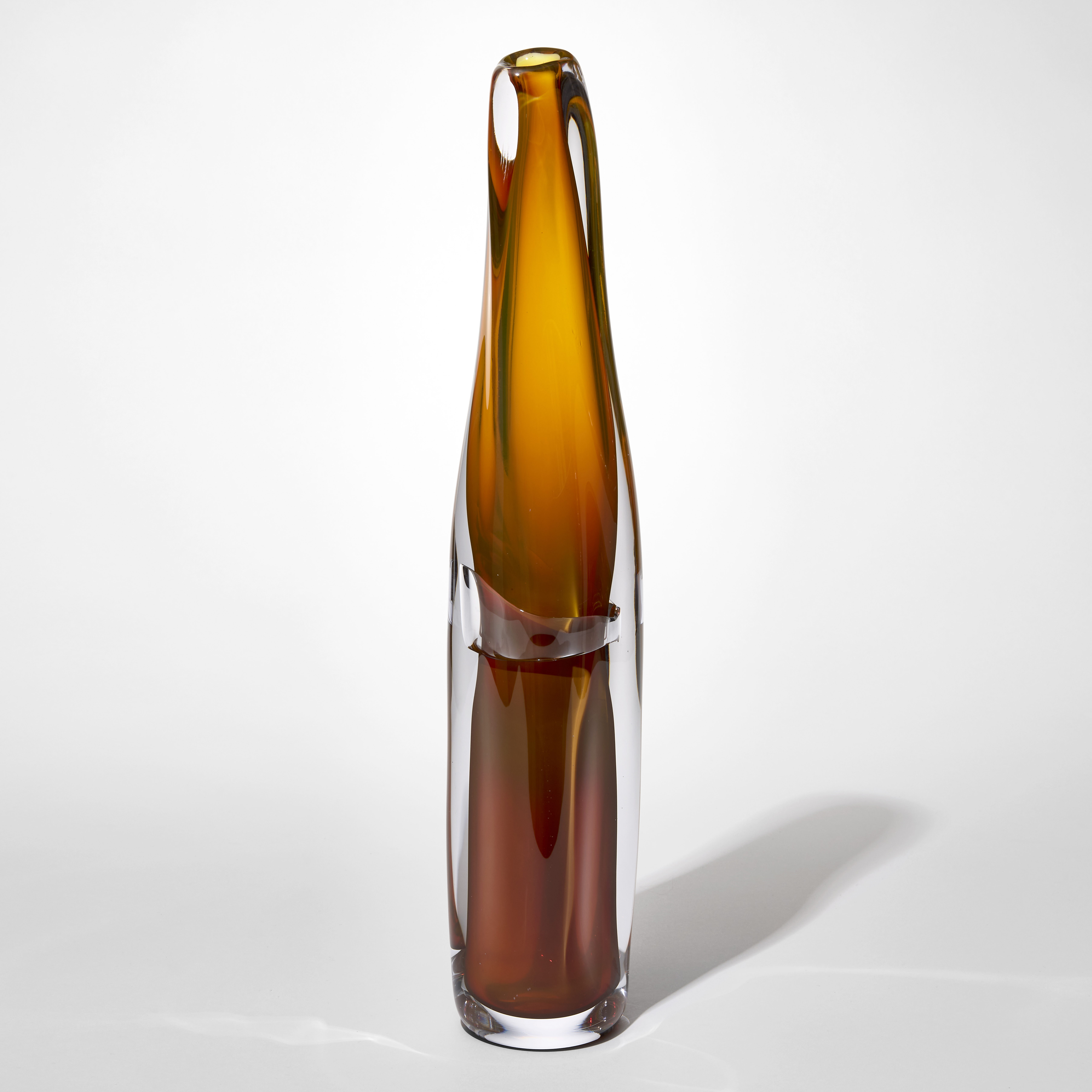 tall twisting tapering soft column shaped vase with an outer clear layer and inner soft undulating layer in burnt toffee amber hand blown from glass