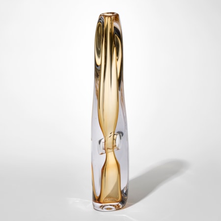 tall transparent fluid and slightly twisting vessel with small top opening and an outer later in clear and inner trapped undulating layer in light golden amber hand blown from glass