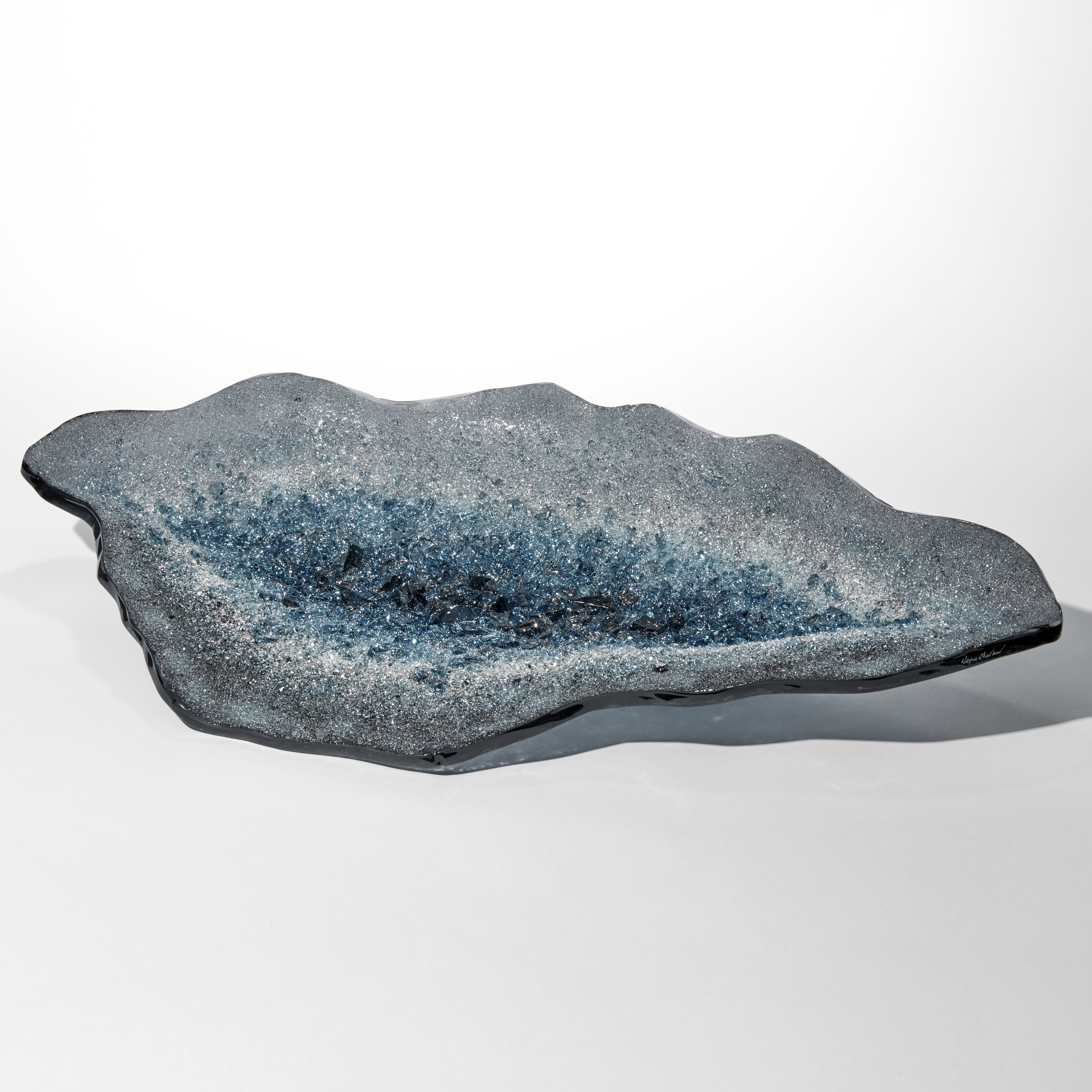 geode inspired centrepiece with the top surface covered in twinkling crystals in grey white and aqua blue hand made from glass
